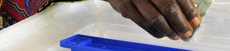 Côte d'Ivoire Holds Legislative By-Elections - A woman casts her ballot in the legislative by-election in Grand Laho, Côte d'Ivoire. By-elections were organized in eleven of the country's constituencies after irregularities were found in the original vote held on 11 December.